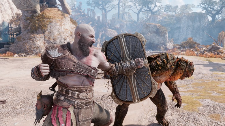 GoW Ragnarok Kratos hitting an enemy with a shield