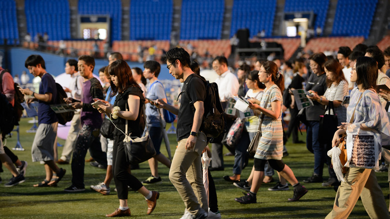 Crowd of people playing Pokémon GO