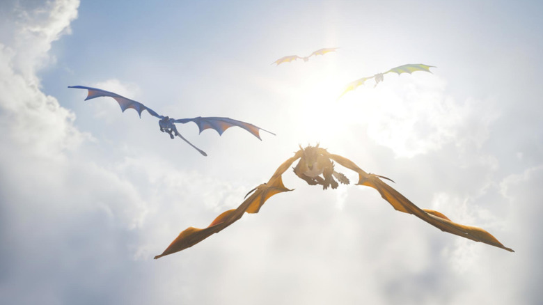 Dragons flying in sky