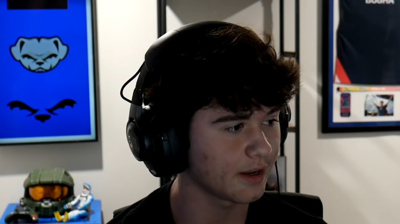 Bugha wearing over the ear headphones