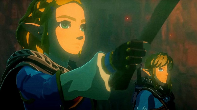 Zelda holds torch Link